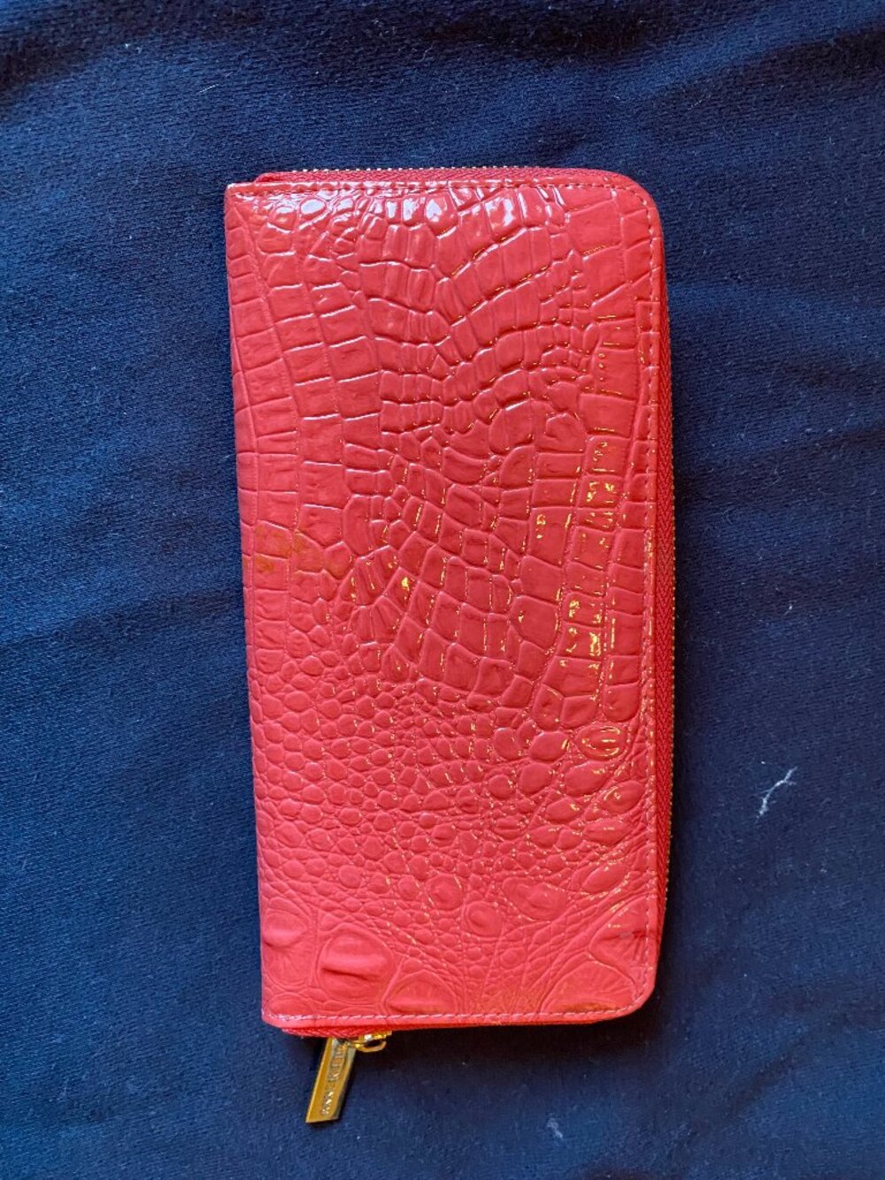 Anne Klein coral animal embossed zipper wallet